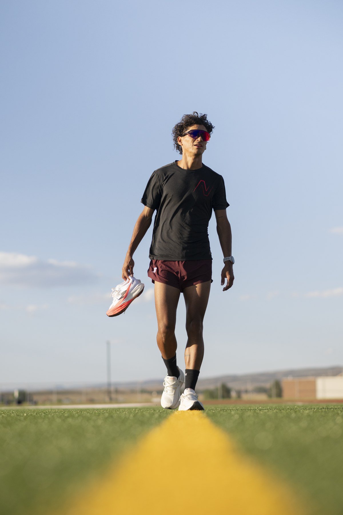 Athlete on track with running shoes