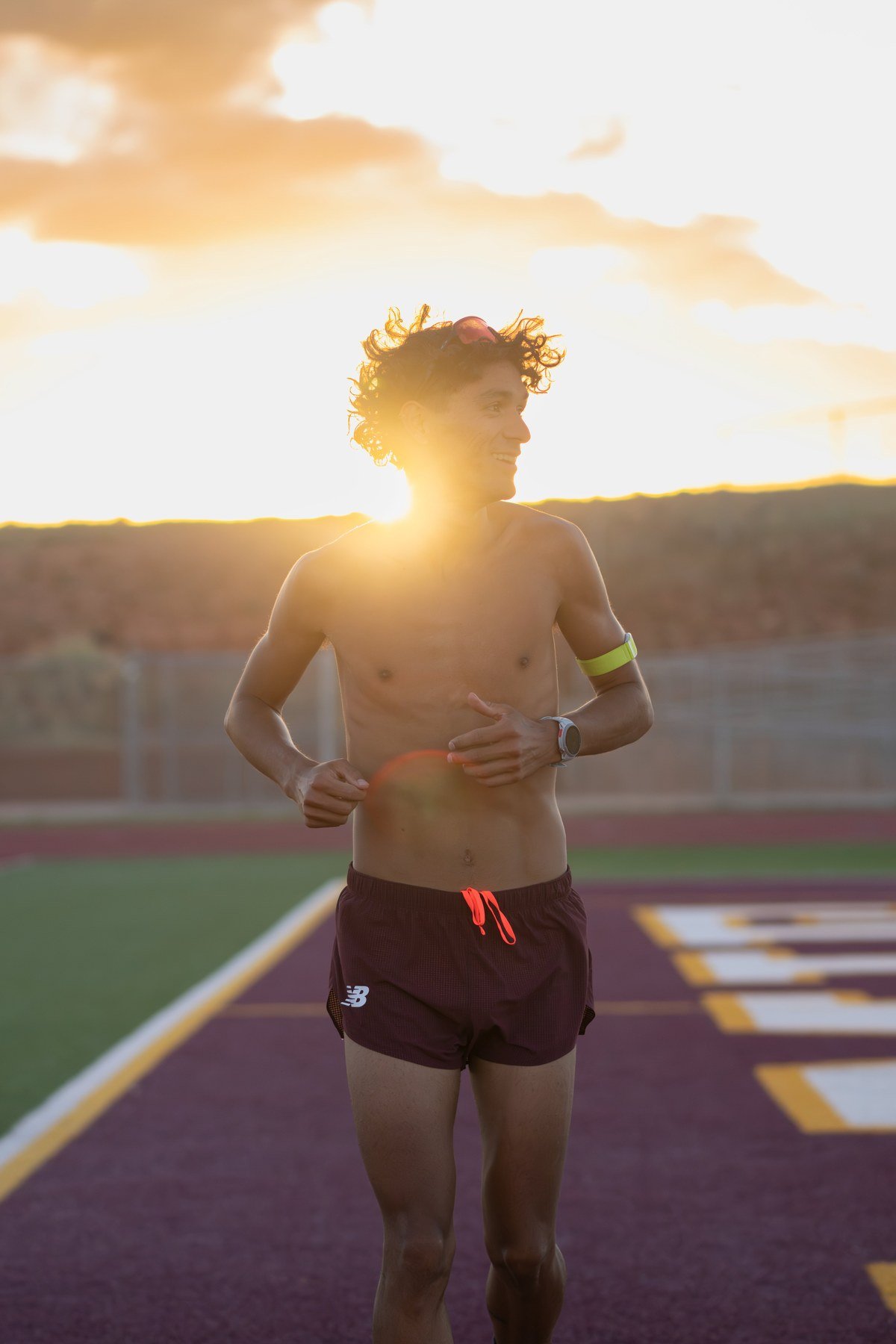 Runner at sunset on track